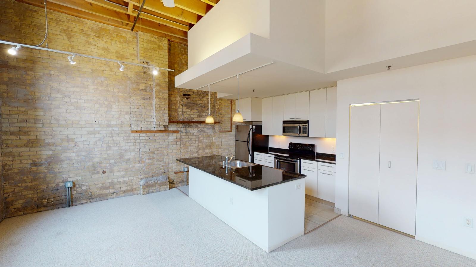 Spacious one bedroom apartment with a blend of historic and contemporary design at Tobacco Lofts at The Yards in downtown Madison