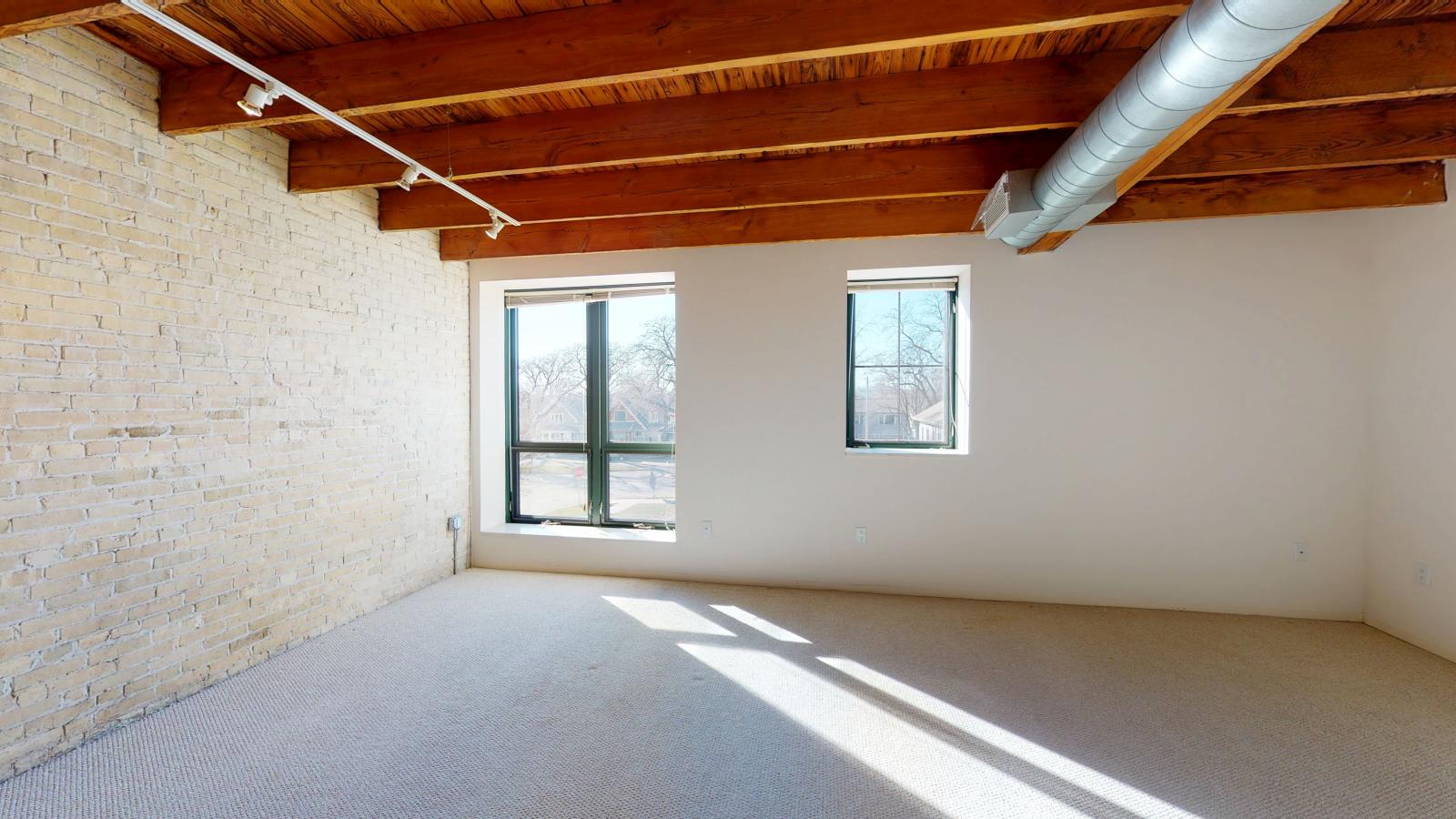 Studio with abundant natural light and industrial-style charm at Tobacco Lofts at The Yards in downtown Madison