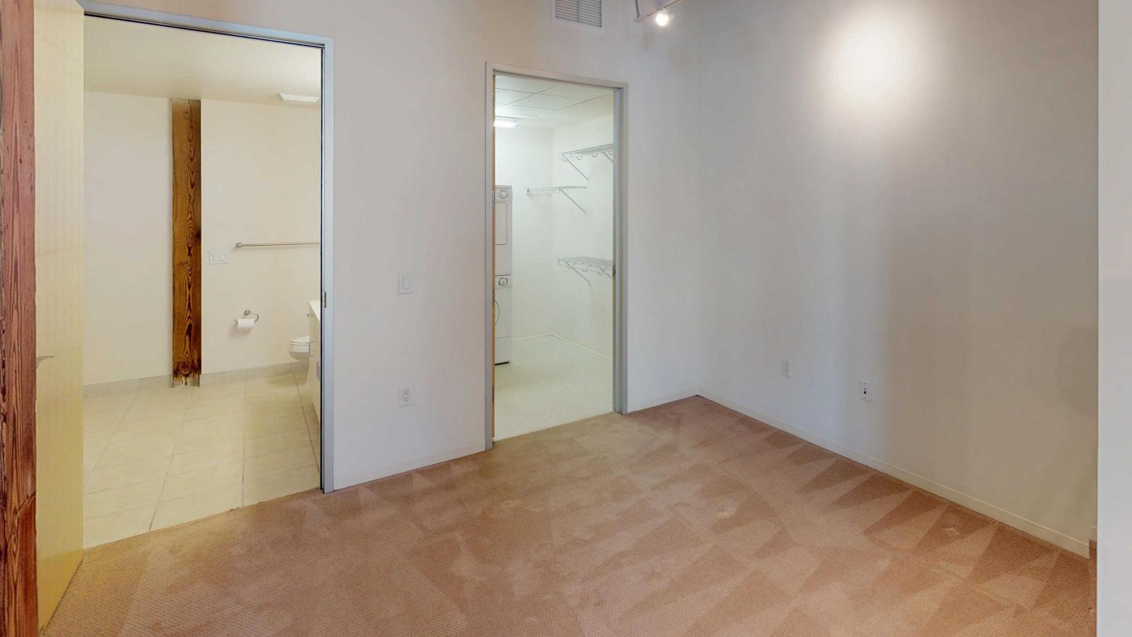 Bright studio apartment with oversized closet and high ceilings at Tobacco Lofts