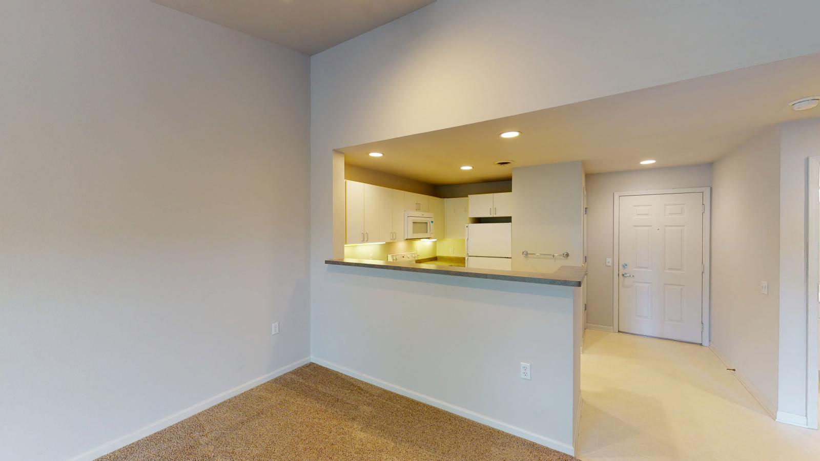 Classic-style kitchen with standard appliances and traditional cabinetry at Wilson Bay Apartment 310 