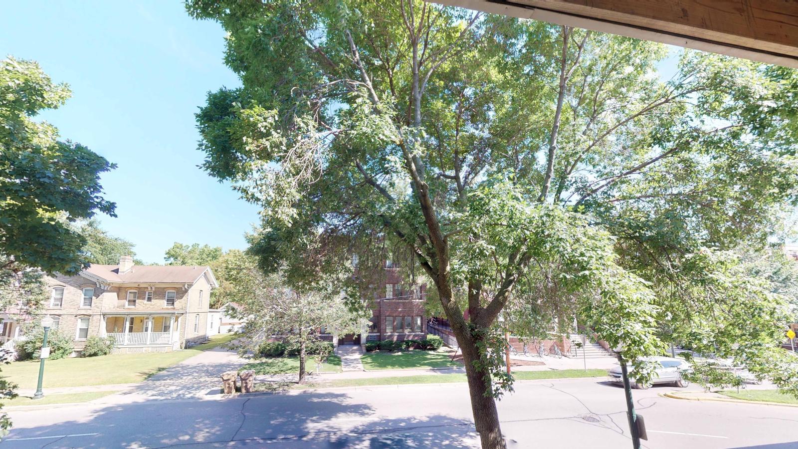 Private balcony offering neighborhood views in a one-bedroom at Wilson Bay