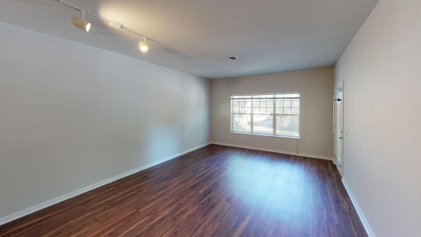 Cozy living room with soft finishes and abundant natural light at Wilson Bay