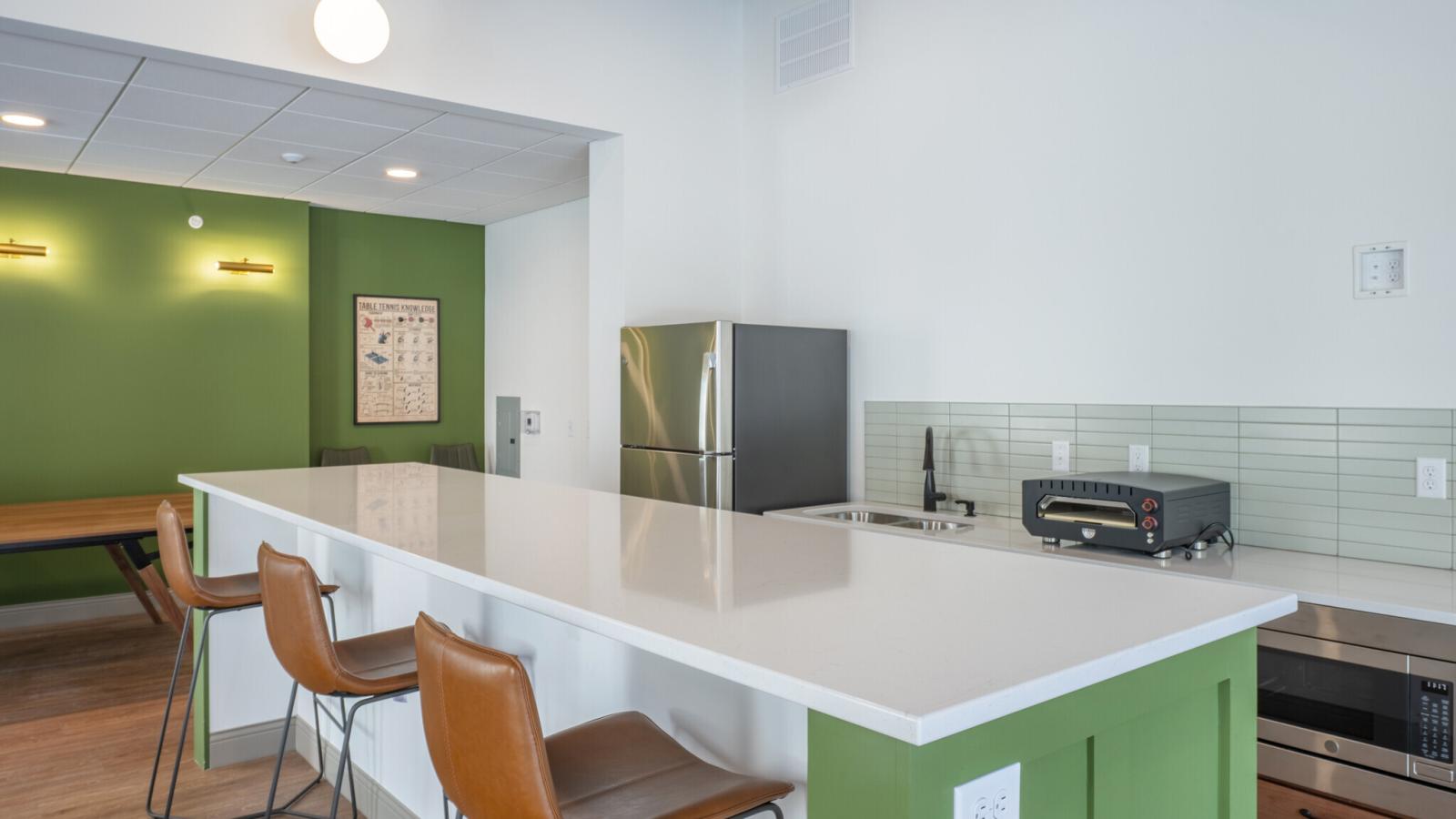 The community room at The Irwin Apartments offers a relaxing fun space for residents 