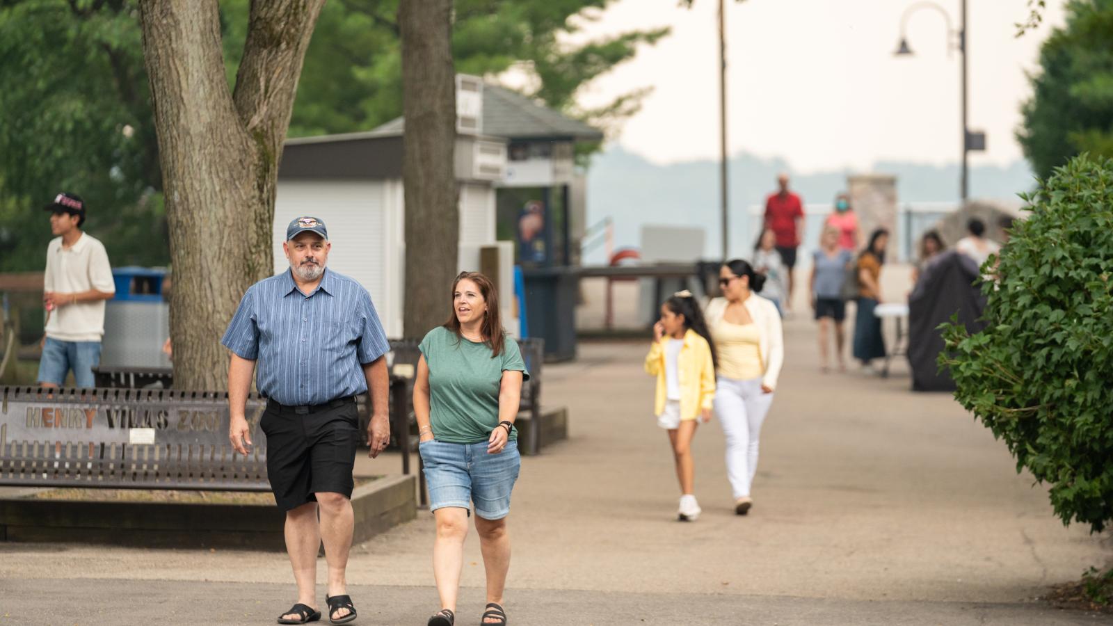 Urban Land Interests employees and their families walking through Henry Vilas Zoo during the annual company picnic in Madison