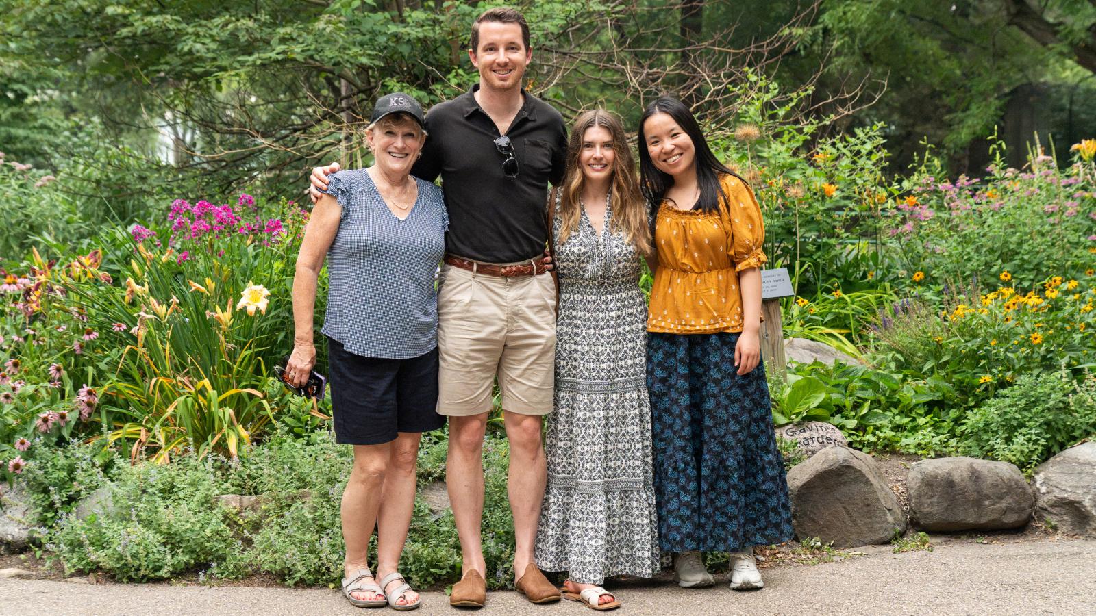 Urban Land Interests employees and their family members posing together in the gardens at Henry Vilas Zoo during the annual company picnic