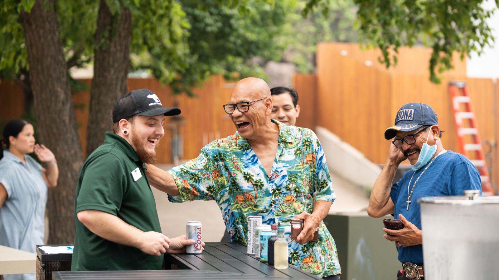 ULI employees and guests enjoying refreshments and spending time together during the annual company picnic at Henry Vilas Zoo in Madison