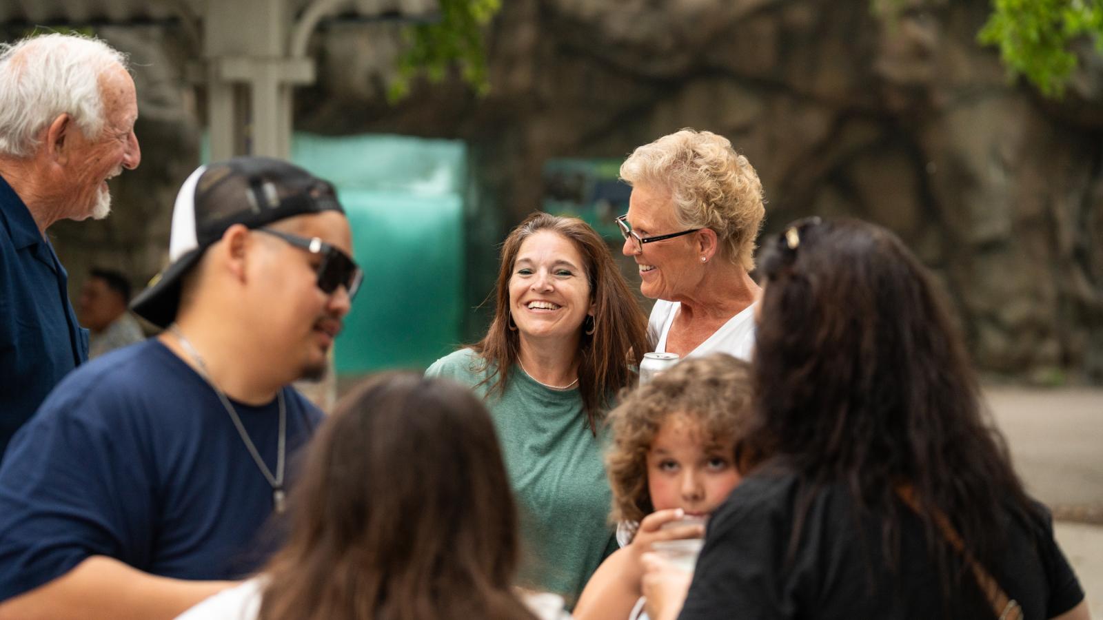 Urban Land Interests employees and their families sharing conversation and refreshments during the annual company picnic at Henry Vilas Zoo