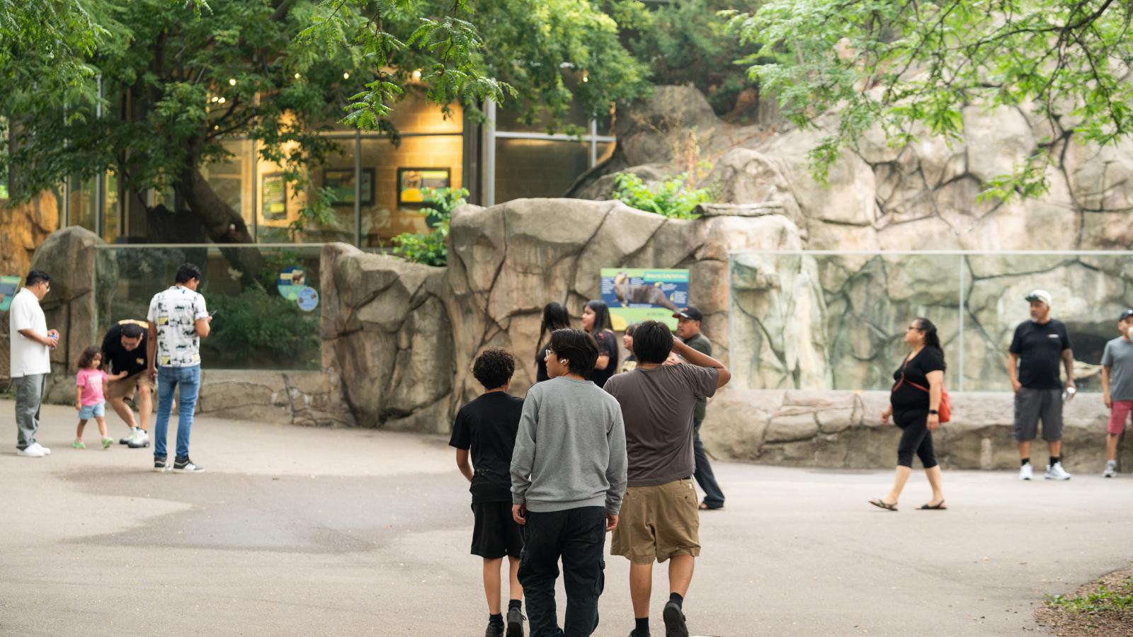 ULI employees and their families walking through animal exhibits during the annual company picnic at Henry Vilas Zoo in Madison