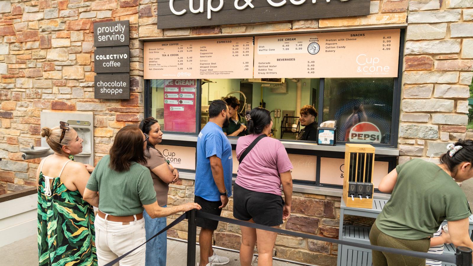 10.	Employees and their families gathering outside the Cup and Cone stand at Henry Vilas Zoo
