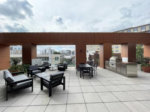Outdoor terrace at The Pressman offering a beautiful outdoor space, gas grill, and stunning sunsets in downtown Madison